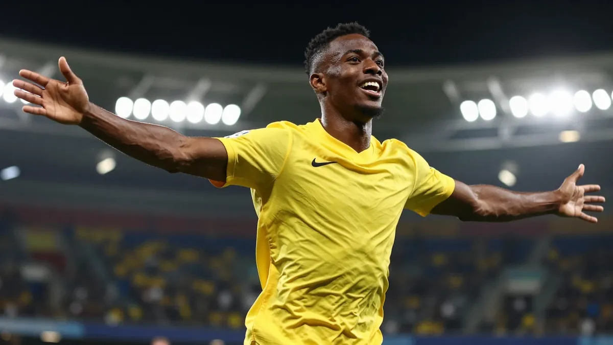 A Reuters photo captures Borussia Dortmund's Jadon Sancho celebrating his second goal in the Bundesliga match against FC...